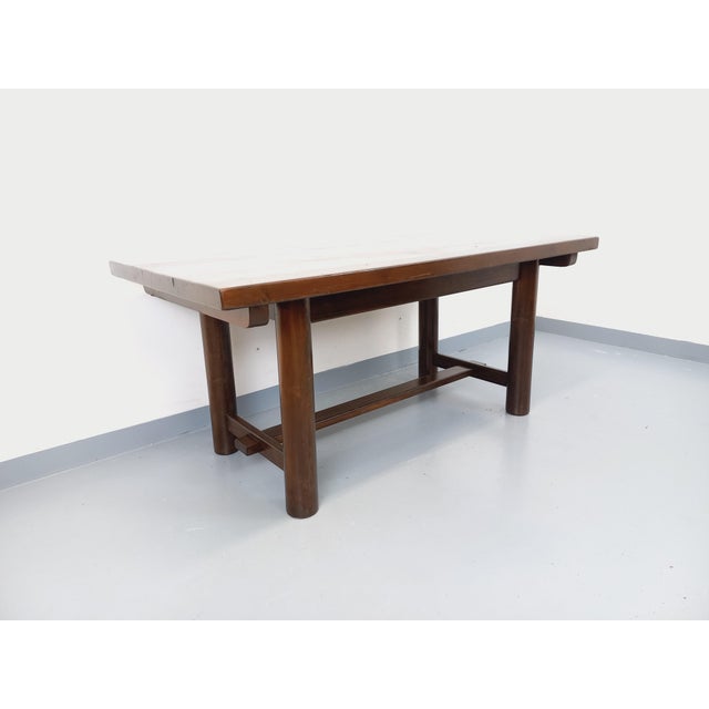 Vintage rectangular dining table from the 1950s/60s, made of solid dark pine, French design attributed to Georges Robert,...
