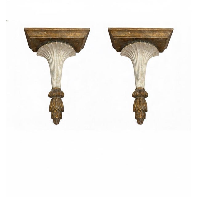 This exquisite pair of carved wood wall pockets, or small consoles, offers a touch of classic architectural sophistication...