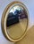 French Provincial Oval Cream and Gold Leaf Wall Mirror For Sale - Image 3 of 7