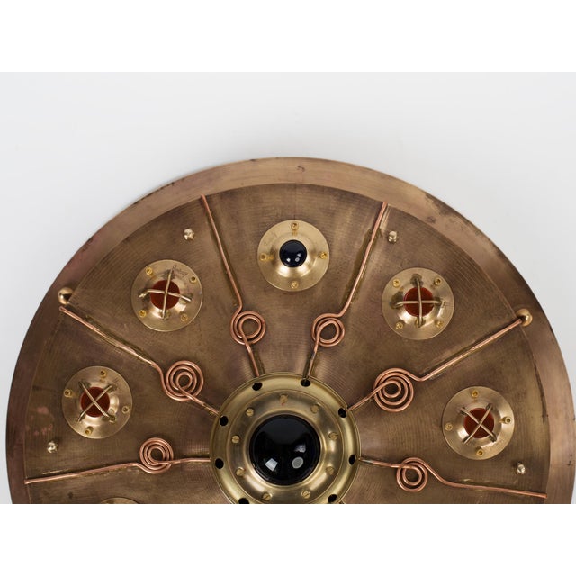 This striking, one-of-a-kind wall sconce is a masterclass in Dieselpunk and Sci-Fi aesthetic. Handcrafted from high-...