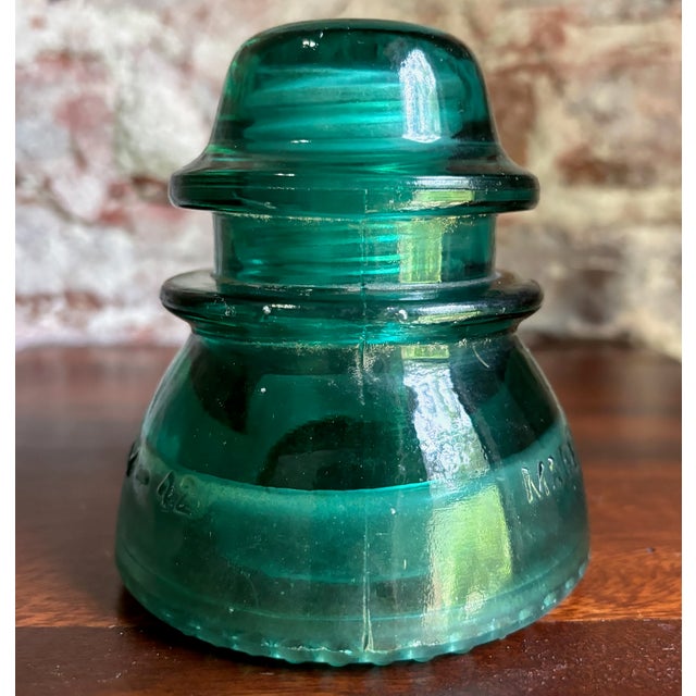 This is a gorgeous antique Hemingray-42 vintage glass telephone/telegraph insulator in attractive aqua-blue glass....