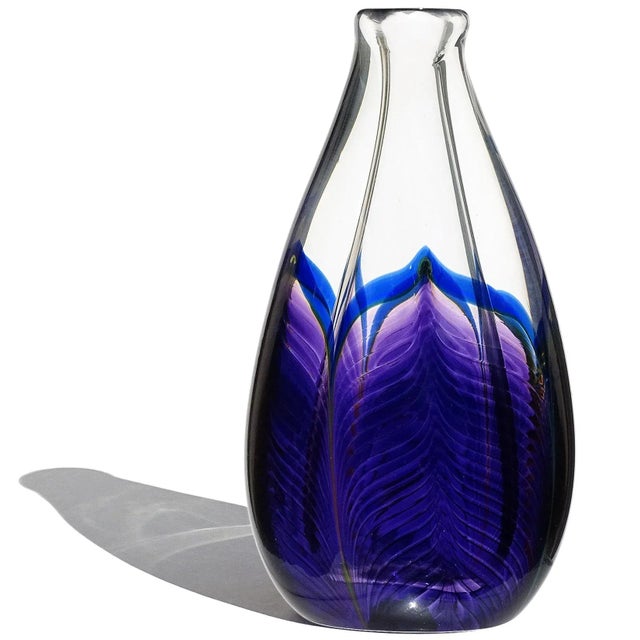 Beautiful vintage American hand blown, purple and blue pulled peacock feather design, art glass bud flower vase. The vase...