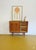 A vintage Danish teak sideboard from the 1950s with sliding doors and an elegant, compact design, perfect for a functional...