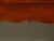 An English walnut or yew wood dresser base from the mid 20th century, with three drawers and carved apron. Created in...