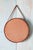 A danish mid century modern mirror featuring a beveled finger jointed teak frame. The mirror hangs form a thin leather...