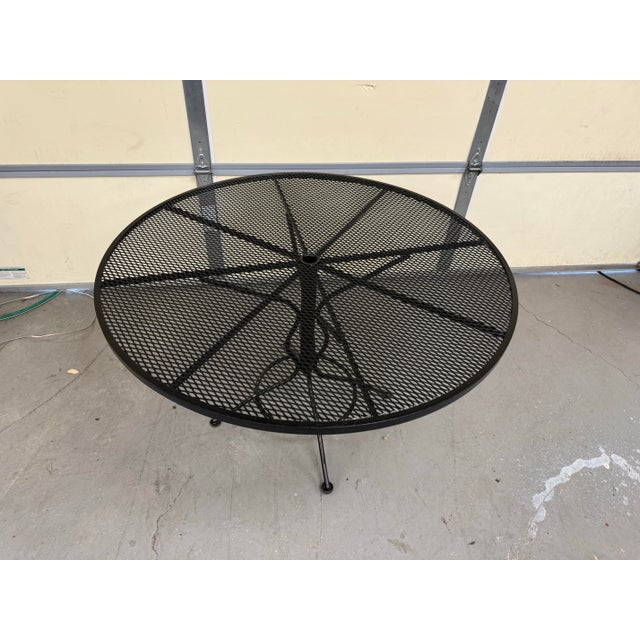 Mid-Century Outdoor Iron Woodard Round Dining Table Offered is a Mid-Century Outdoor Iron Woodard Round Dining Table....