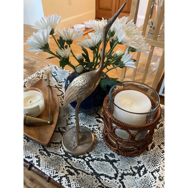 A solid brass crane figure. A single crane (originally part of a set from the 1960's Hollywood Regency Style). Add a touch...