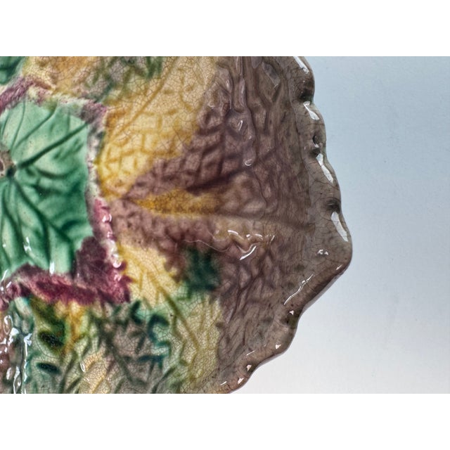 This 19th century English Majolica begonia leaf plate is glazed in glossy shades of green, soft brown and earthy yellow....