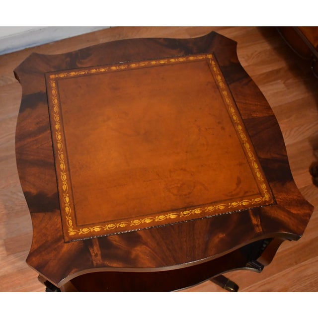 We are pleased to offer this beautiful pair of Regency side tables, from the 1930s . This pair is made of Flame Mahogany...