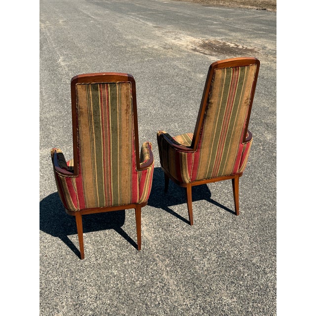 Dramatically tall back, with skillfully joined walnut frame showing, in their original velvet upholstery reminiscent and...