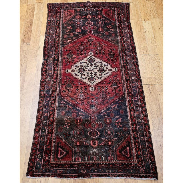 "This beautifully handwoven vintage Persian Hamadan area rug from the early to mid-20th century features a composition...
