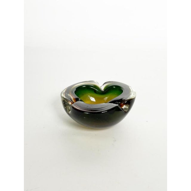 Thick, two-tone glass ashtray, France, 1960s. An elegant, thick, molded glass ashtray featuring a striking color gradient...