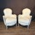 Pair of French Louis XV bergère chairs, distinguished by delicately carved floral and foliate motifs along the apron,...