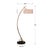Curved metal finished in a brushed brass accented with a matte black foot. The round hardback drum shade is a beige linen...