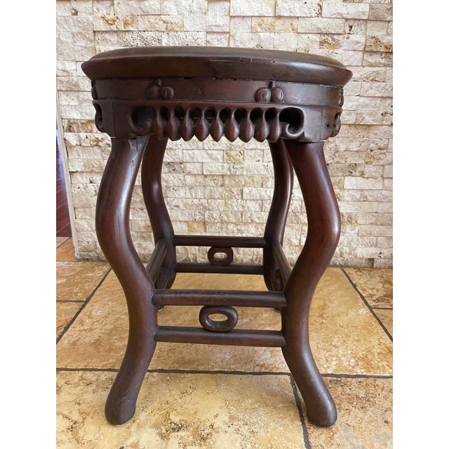 A pair of rarely used antique Chinese stools/tables. These pieces are well crafted, very heavy and sturdy. The bas of the...