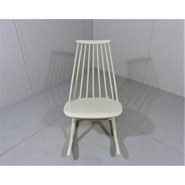 Rocking chair Mademoiselle by Ilmari Tapiovaara for Asko, Finland. Orgininal white lacquered solid birch wood. Beneath the...