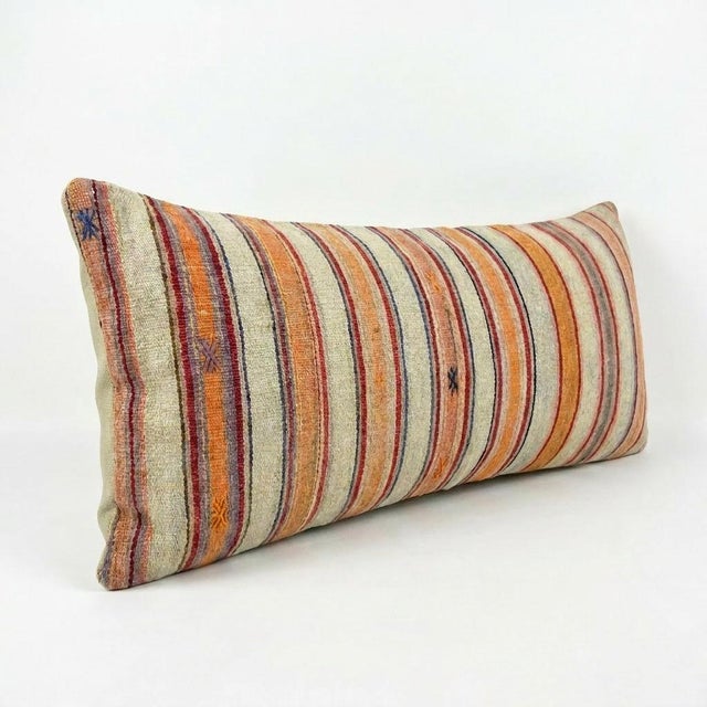 This beautiful 17'' x 61'' hand-woven Kilim pillow cover was made from an authentic Turkish kilim. The traditional flat-...