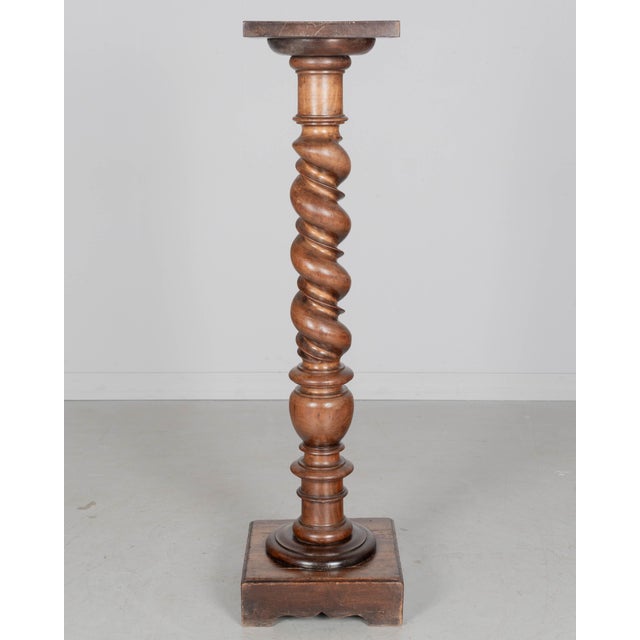 A late 19th Century French Louis XIII Revival barley twist column pedestal made of dark stained solid beech wood. Deep,...