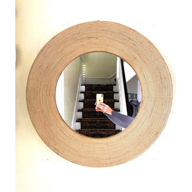 Wonderful 30" round mirror is encircled by rattan, creating a circular wall accent that brings organic texture and...
