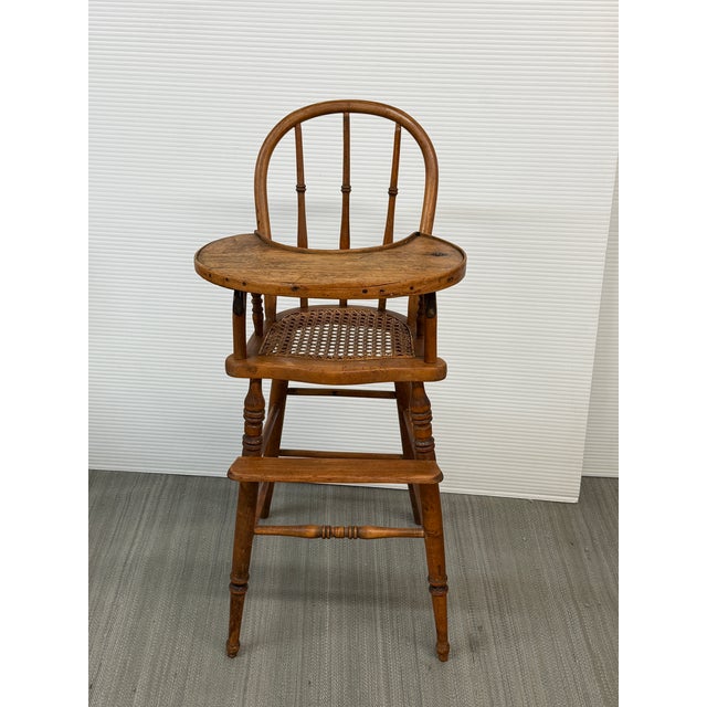 Design Plus Gallery presents an Antique 19th Century Victorian Cane Seat Child’s Highchair. Dating to the late 1800s, this...