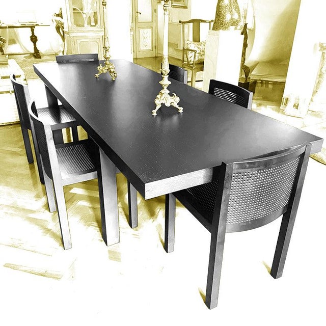 Large wenge designer table with four square legs connected to the top by a minimal steel support. In perfect condition....