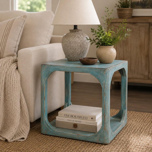 Worked from solid wood, this soft aqua wood side table keeps the honest character of a piece made one at a time. It...