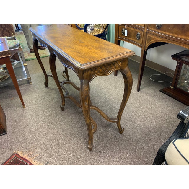 20th Century oak French Louie style console. Serpentine stretcher along bottom, cabriole legs and a lovely diamond carved...