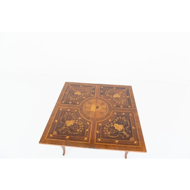 Amazing French walnut inlaid games table This wonderful walnut games table is raised upon cabriole legs with a shaped...