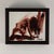 This artwork depicts a figure in a dynamic, crouched posture, capturing a moment of intense physicality and motion. The...