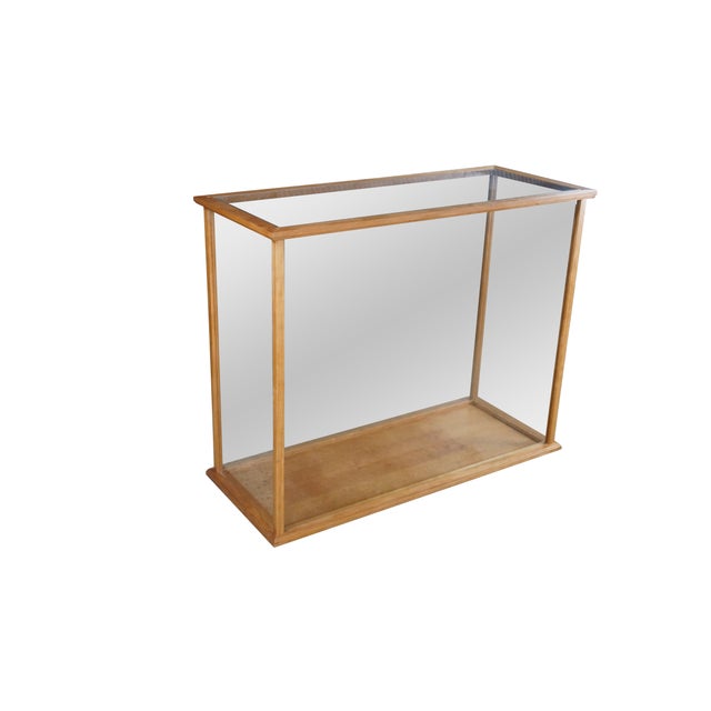 Large vintage glass paneled curio display case made from maple featuring 360 degrees of viewing. Originally housed a model...