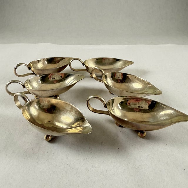 A set of six Mid-Century Era individual mini sauce or dressing boats, Alpacca Nickel Silver, Italy, circa 1960s. Each...