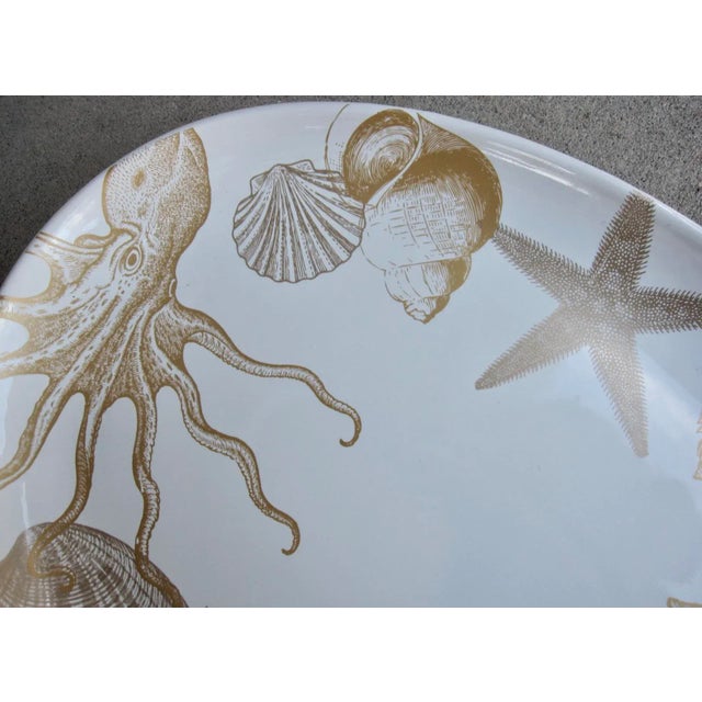 Beautiful ceramic platter from 222 Fifth "Coastal Life Gold" is the perfect server for seafood feasts. Pattern features...