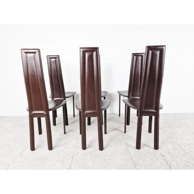 Set of 6 dark brown italian leather high back dining chairs. Beautiful sleek and timeless design. The chairs are in fair...
