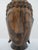 Hand carved wooden Balinese buddha head sculpture. Serene Buddha with closed eyes meticulously hand carved from richly...