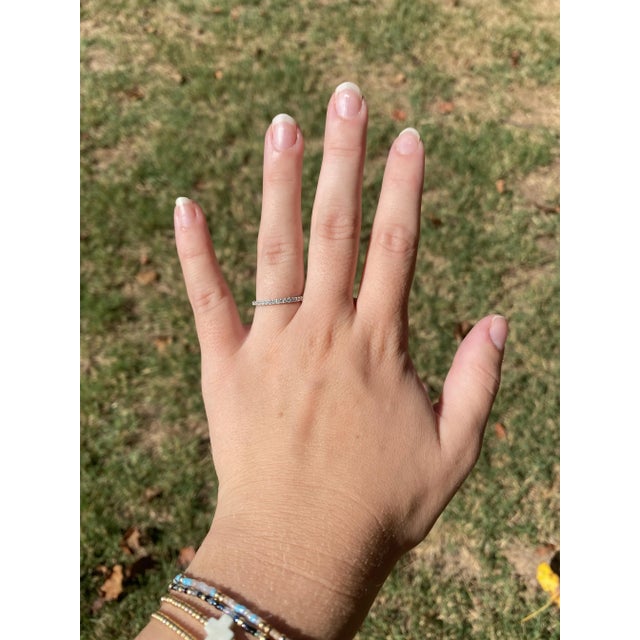 Stones: diamonds, 18 stones round brilliant cut 1.5 mm approximately .25 total carats G-H color, SI2-I1 clarity Ring Size...