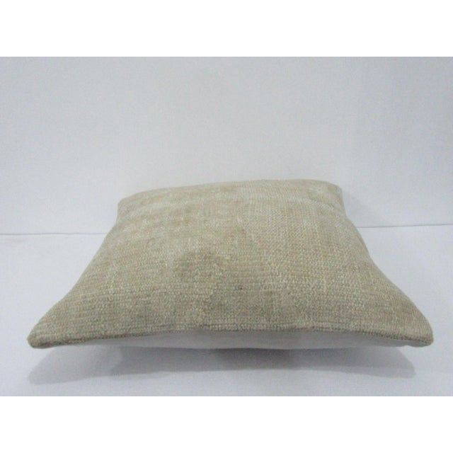 Decorative pillow cover made from a vintage Turkish handknotted rug. Backed with good quality cotton fabric. Pillow...