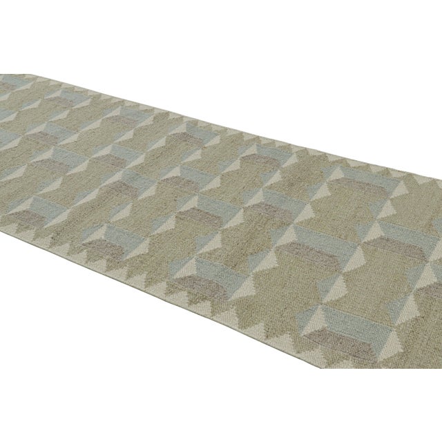 Handwoven in a wool flatweave, this 4x12 runner rug is an exciting new addition to Rug & Kilim’s Scandinavian rug...