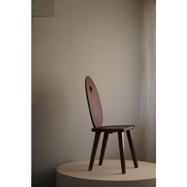 A rare primitive dining / office chair in stained pine. Made in the style of Carl Malmsten "Skedblad" in the early 1900s....