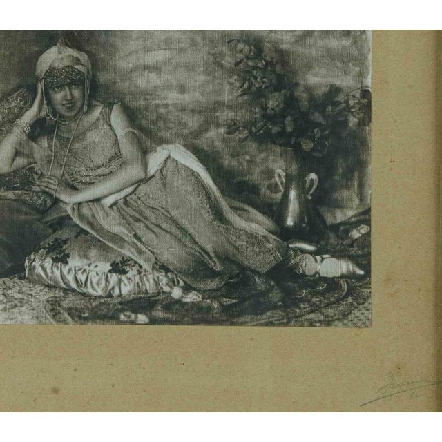 Arabic girl is a silver salt print realized in the early 20th century. Hand signed lower right in red pencil, not...