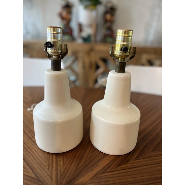 A wonderful pair of mid-century modern bedside lamps from the Danish husband and wife creators, Gunnar and Lotte Bostlund....