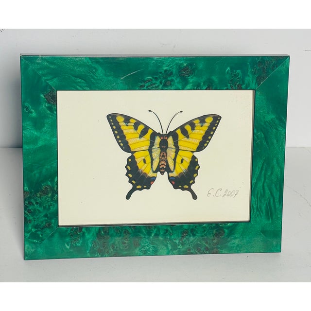 Vintage butterfly collage in a faux malachite frame.