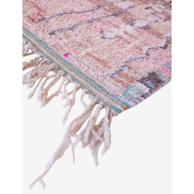 Introduce bohemian flair to your home with our Moroccan Handknotted Berber Rug. Measuring 6 x 4.5 ft, this abstract rug...