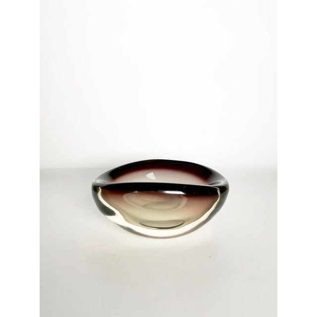 Large Italian purple art glass ashtray or catchall dating from the 1960s. Featuring a sculptural rounded form with a deep...