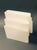 Vintage Italian mid-century white plastic magazine rack with six compartments and a round handle, designed by Giotto...