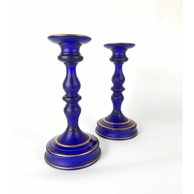 1930s Art Deco candlesticks and centerpiece pedestal bowl in cobalt blue satin glass with gilt decoration. Very good...