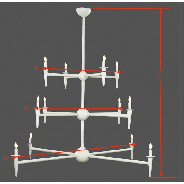 A striking expression of sculptural modernism, the Avron 12-Branch Chandelier by Bourgeois Bohème Atelier commands...