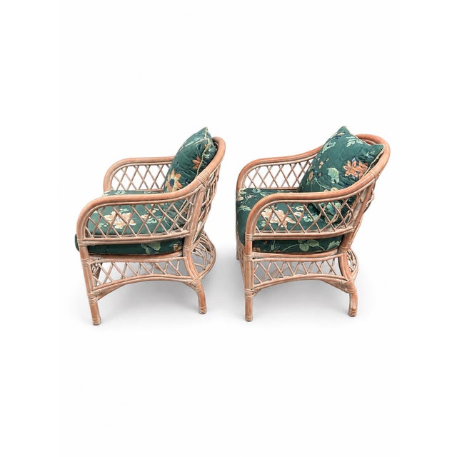 A delightful pair of vintage Henry Link wicker lounge chairs in their original blush pink finish. These substantial, well-...