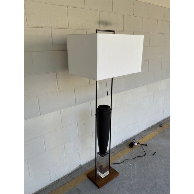 Stylish Arteriors Foundry Floor Lamp. White rectangular shade, metal frame, decorative sculptural vase on top of acrylic...