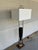 Stylish Arteriors Foundry Floor Lamp. White rectangular shade, metal frame, decorative sculptural vase on top of acrylic...
