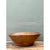 This vintage bowl is a monumental, hand-carved vessel with a broad, softly oval form that flares from a narrow, flat foot...